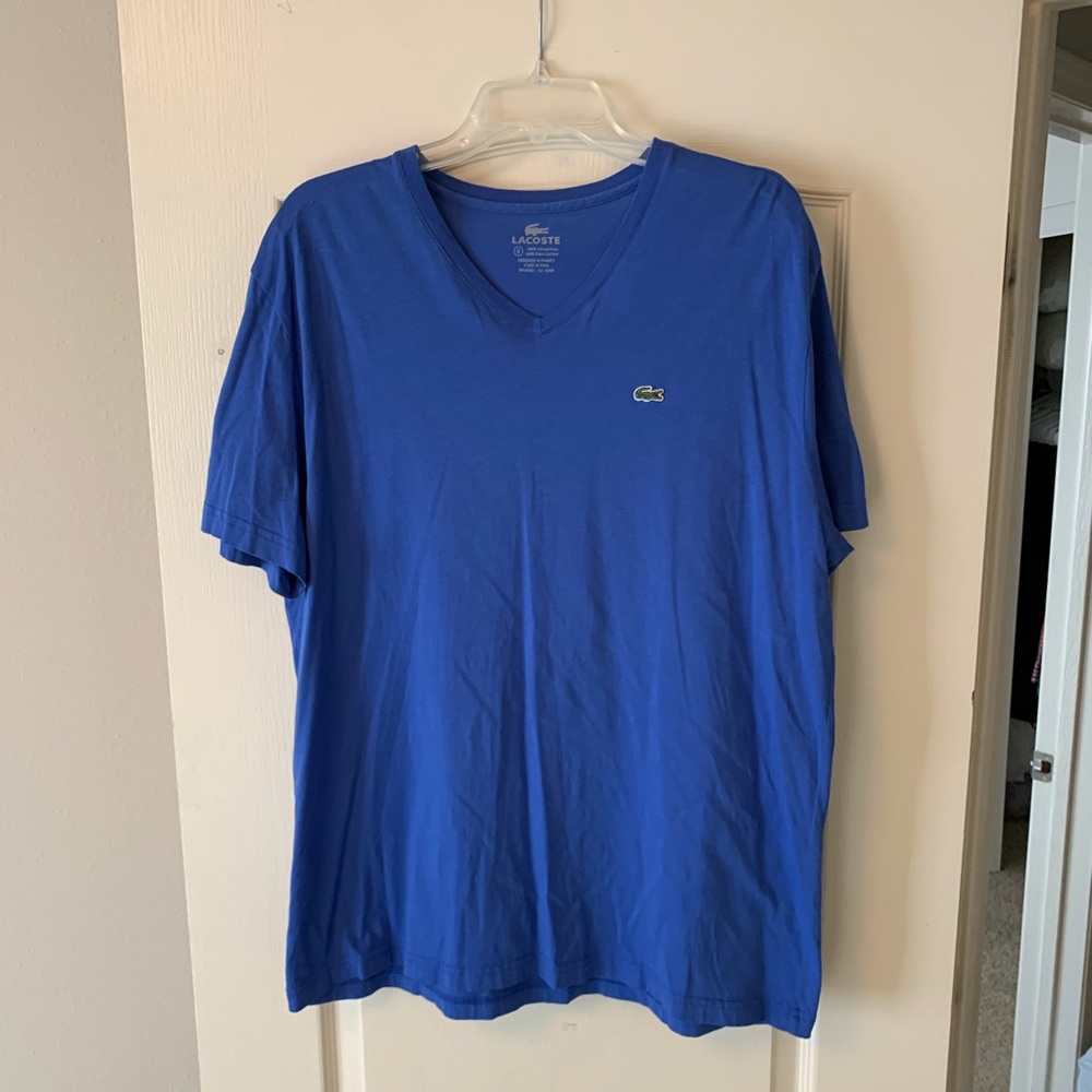 Lacoste blue v neck T-shirt.